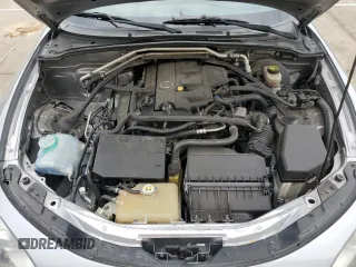 2009 Mazda MX-5 Miata Grand Touring z VIN JM1NC25F090202047, wystawiony jako Copart lot #55810505 z przebiegiem 91 618 mil mil oraz Szkody całkowita. Historia ofert i sprzedaży dostępna na DreamBid. Obrazek 11.
