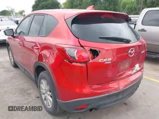 2015 Mazda CX-5 Touring with VIN JM3KE4CYXF0439953, listed as a IAAI auction lot 42124197 with 242,614 mi miles and . Bid and sale history available at DreamBid. Image 3.