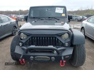 2014 Jeep Wrangler Unlimited Sport with VIN 1C4BJWDG6EL239378, listed as a IAAI auction lot 42073392 with 120,999 mi miles. Bid and sale history available at carsss.com. Image 13.