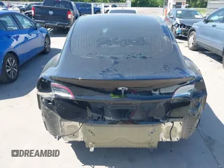 2018 Tesla Model 3 Long Range Battery with VIN 5YJ3E1EA7JF098632, listed as a IAAI auction lot 42002181 with 73,371 mi miles and . Bid and sale history available at DreamBid. Image 6.
