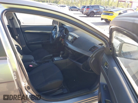 2015 Mitsubishi Lancer SE with VIN JA32V2FWXFU023626, listed as a IAAI auction lot 42012381 with 143,981 mi miles. Bid and sale history available at carsss.com. Image 5.
