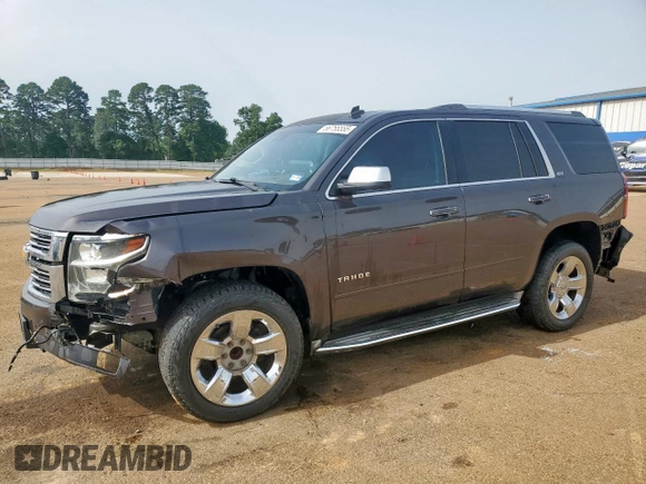 2015 Chevrolet Tahoe LTZ z VIN 1GNSCCKC8FR102859, wystawiony jako Copart lot #56755555 z przebiegiem 167 191 mil mil oraz Czysty tytuł • Clean title. Historia ofert i sprzedaży dostępna na DreamBid. Obrazek 1.