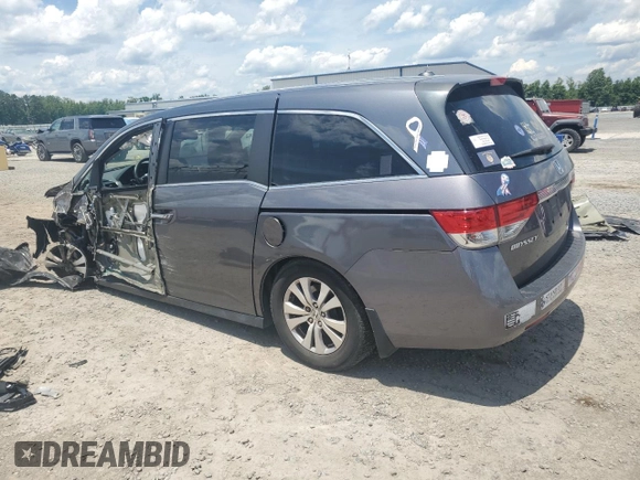 2014 Honda Odyssey EX-L with VIN 5FNRL5H62EB112280, listed as a Copart auction lot 60138645 with 167,657 mi miles and Salvage title. Bid and sale history available at DreamBid. Image 2.