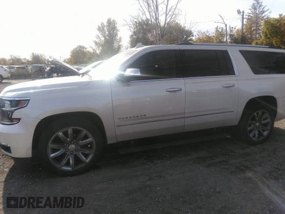 2015 Chevrolet Suburban LTZ with VIN 1GNSKKKC0FR551031, listed as a IAAI auction lot 40694559 with 184,261 mi miles. Bid and sale history available at carsss.com. Image 14.