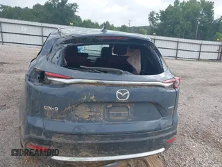 2021 Mazda CX-9 Grand Touring with VIN JM3TCADY2M0509286, listed as a IAAI auction lot 39976279 with 93,588 mi miles and . Bid and sale history available at DreamBid. Image 12.