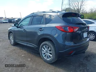2016 Mazda CX-5 Touring with VIN JM3KE4CYXG0620990, listed as a IAAI auction lot 41978738 with 91,237 mi miles and . Bid and sale history available at carsss.com. Image 3.