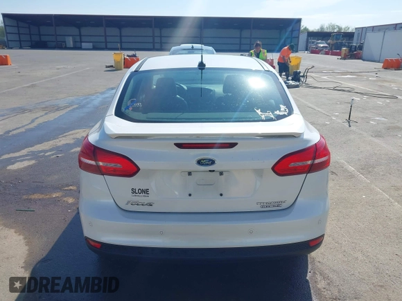 2016 Ford Focus Titanium z VIN 1FADP3J23GL358772, wystawiony jako IAAI lot #42103694 z przebiegiem 85 290 mil mil oraz . Historia ofert i sprzedaży dostępna na DreamBid. Obrazek 16.