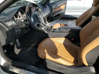 2016 Mercedes-Benz E-Class E 400 with VIN WDDKJ6FB0GF348458, listed as a Copart auction lot 87701385 with 124,867 mi miles and Salvage Title. Bid and sale history available at carsss.com. Image 7.
