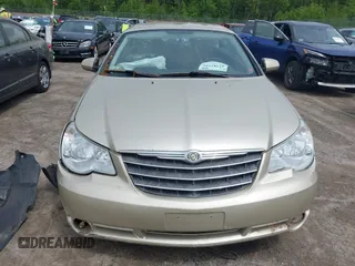 2010 Chrysler Sebring Limited z VIN 1C3BC6EV9AN122372, wystawiony jako IAAI lot #42382181 z przebiegiem 34 454 mil mil oraz . Historia ofert i sprzedaży dostępna na DreamBid. Obrazek 12.