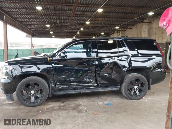 2015 Chevrolet Tahoe LT with VIN 1GNSKBKCXFR604401, listed as a IAAI auction lot 42048559 with 60,768 mi miles and . Bid and sale history available at DreamBid. Image 14.