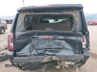 2019 GMC Yukon XL SLT with VIN 1GKS2GKC0KR345860, listed as a IAAI auction lot 40727072 with 127,568 mi miles and . Bid and sale history available at carsss.com. Image 17.