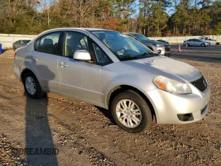 2012 Suzuki SX4 LE with VIN JS2YC5A38C6300439, listed as a Copart auction lot 85121124 with 74,324 mi miles and Clean Title. Bid and sale history available at carsss.com. Image 4.