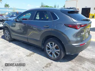 2025 Mazda CX-30 S Carbon Edition z VIN 3MVDMBCMXSM751668, wystawiony jako IAAI lot #42329444 z przebiegiem 16 735 mil mil oraz . Historia ofert i sprzedaży dostępna na DreamBid. Obrazek 3.