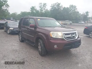 2010 Honda Pilot Touring z VIN 5FNYF4H9XAB001199, wystawiony jako IAAI lot #42336171 z przebiegiem 213 151 mil mil oraz . Historia ofert i sprzedaży dostępna na DreamBid. Obrazek 1.