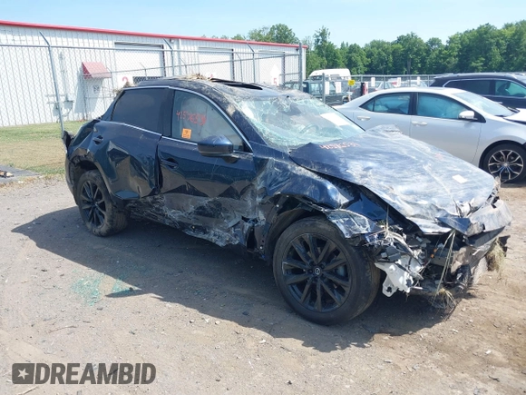 2023 Mazda CX-9 Touring Plus z VIN JM3TCBAY3P0637700, wystawiony jako IAAI lot #42576531 z przebiegiem 19 483 mil mil oraz . Historia ofert i sprzedaży dostępna na DreamBid. Obrazek 1.
