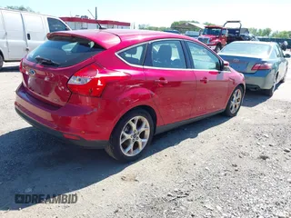 2012 Ford Focus SEL with VIN 1FAHP3M22CL335913, listed as a IAAI auction lot 42143922 with 129,421 mi miles. Bid and sale history available at carsss.com. Image 4.