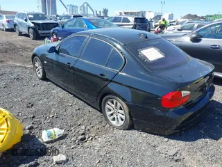 2007 BMW 3 Series 328xi with VIN WBAVC93547KX56693, listed as a IAAI auction lot 41852323 with 250,156 mi miles. Bid and sale history available at carsss.com. Image 3.