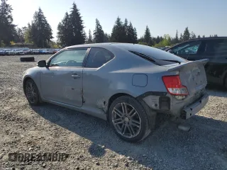 2011 Scion tC with VIN JTKJF5C76B3000765, listed as a Copart auction lot 53954445 with 243,554 mi miles and Salvage Title. Bid and sale history available at carsss.com. Image 2.
