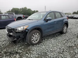 2015 Mazda CX-5 Sport z VIN JM3KE4BY7F0496497, wystawiony jako Copart lot #57249465 z przebiegiem 115 987 mil mil oraz Szkoda całkowita • Salvage title. Historia ofert i sprzedaży dostępna na DreamBid. Obrazek 1.