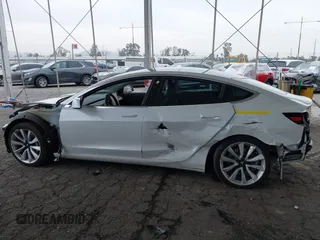 2020 Tesla Model 3 Long Range with VIN 5YJ3E1EB5LF801530, listed as a IAAI auction lot 41682050 with 65,743 mi miles. Bid and sale history available at carsss.com. Image 14.