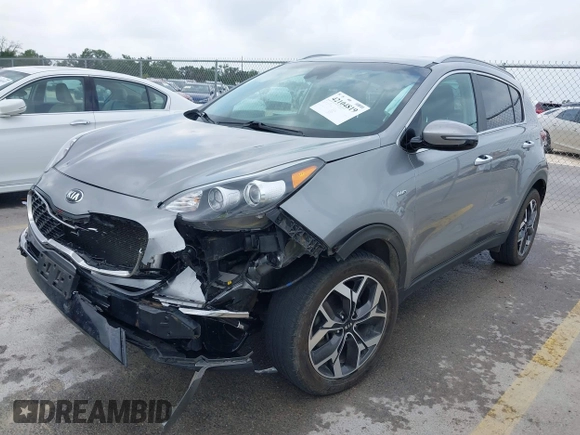 2020 Kia Sportage EX with VIN KNDPNCAC2L7791248, listed as a IAAI auction lot 42104819 with 73,324 mi miles and . Bid and sale history available at DreamBid. Image 2.