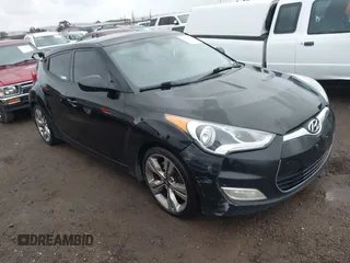 2012 Hyundai Veloster w/Gray Int z VIN KMHTC6ADXCU077850, wystawiony jako IAAI lot #41755389 z przebiegiem 236 059 mil mil oraz . Historia ofert i sprzedaży dostępna na DreamBid. Obrazek 1.