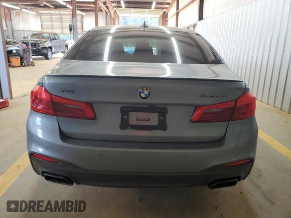 2018 BMW 5 Series M550i xDrive with VIN WBAJB9C55JB050213, listed as a Copart auction lot 61714255 with 34,700 mi miles and Salvage title. Bid and sale history available at DreamBid. Image 6.