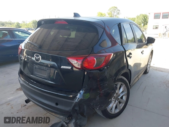 2015 Mazda CX-5 Grand Touring with VIN JM3KE4DY7F0481883, listed as a IAAI auction lot 42091709 with 184,248 mi miles and . Bid and sale history available at DreamBid. Image 4.