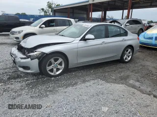 2015 BMW 3 Series 328i with VIN WBA3A5C52FF606921, listed as a Copart auction lot 52021665 with 115,923 mi miles and Salvage title. Bid and sale history available at DreamBid. Image 1.