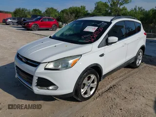 2013 Ford Escape SE with VIN 1FMCU0GX1DUB71466, listed as a IAAI auction lot 42329136 with 103,763 mi miles and . Bid and sale history available at DreamBid. Image 2.