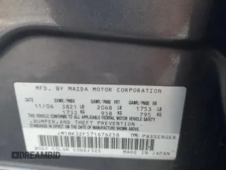 2007 Mazda 3 i Touring with VIN JM1BK32F571676258, listed as a Copart auction lot 87883545 with 141,203 mi miles and Salvage Title. Bid and sale history available at DreamBid. Image 12.
