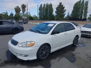 2004 Toyota Corolla CE with VIN JTDBR32E440052035, listed as a IAAI auction lot 42218301 with 299,999 mi miles. Bid and sale history available at carsss.com. Image 6.