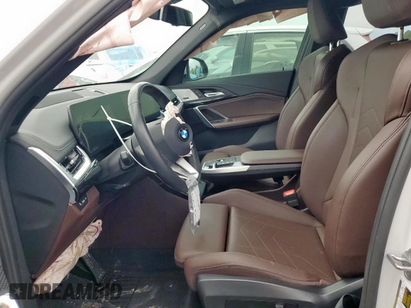 2023 BMW X1 xDrive28i with VIN WBX73EF06P5V77660, listed as a Copart auction lot 57342015 with 32,028 mi miles and Salvage title. Bid and sale history available at DreamBid. Image 7.