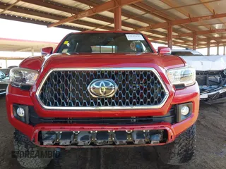 2018 Toyota Tacoma SR with VIN 3TMCZ5AN8JM141486, listed as a IAAI auction lot 42142145 with 54,851 mi miles and . Bid and sale history available at DreamBid. Image 12.