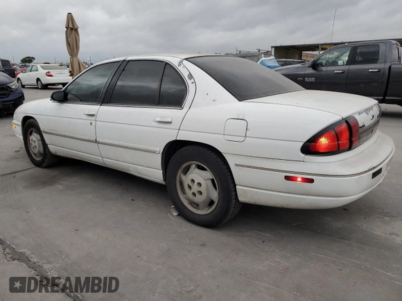 1997 Chevrolet Lumina LS with VIN 2G1WL52M5V9107095, listed as a Copart auction lot 73659954 with 135,669 mi miles and Salvage Title. Bid and sale history available at DreamBid. Image 2.