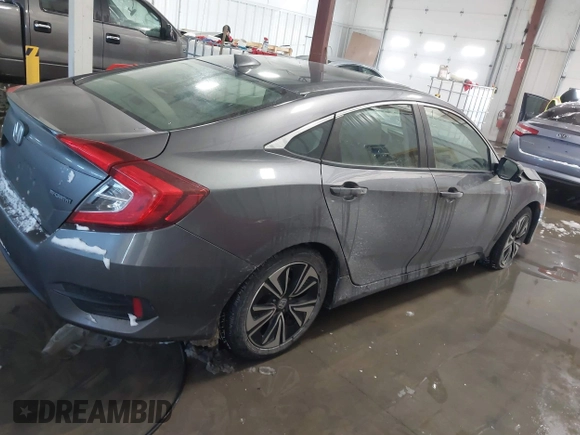 2018 Honda Civic EX-T with VIN JHMFC1F35JX031132, listed as a IAAI auction lot 41591028 with 111,087 mi miles and . Bid and sale history available at DreamBid. Image 13.