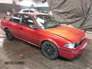 1991 Toyota Corolla z VIN 2T1AE94A4MC063109, wystawiony jako IAAI lot #41357536 z przebiegiem 81 958 mil mil oraz . Historia ofert i sprzedaży dostępna na DreamBid. Obrazek 1.