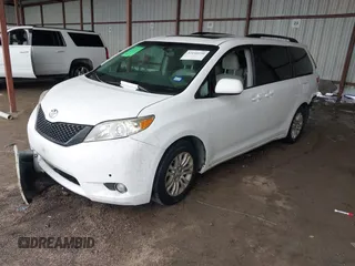 2014 Toyota Sienna XLE with VIN 5TDYK3DC6ES444121, listed as a IAAI auction lot 42110190 with 240,366 mi miles and . Bid and sale history available at DreamBid. Image 2.