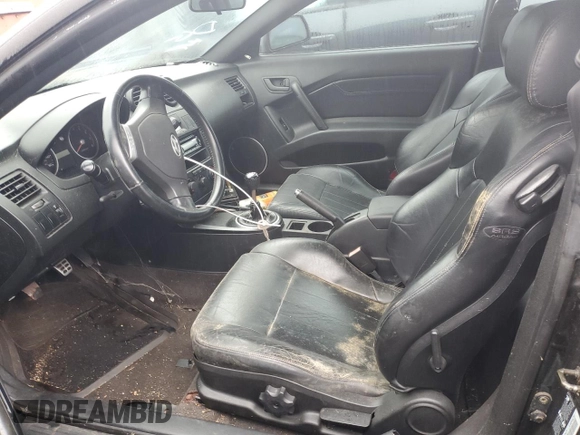 2003 Hyundai Tiburon GT z VIN KMHHN65F13U084620, wystawiony jako Copart lot #46880185 z przebiegiem Nie podano mil oraz Nie do naprawy • Non repairable. Historia ofert i sprzedaży dostępna na DreamBid. Obrazek 7.