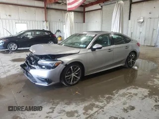 2023 Honda Civic Touring z VIN 2HGFE1F93PH318600, wystawiony jako Copart lot #59259855 z przebiegiem 15 677 mil mil oraz Szkoda całkowita • Salvage title. Historia ofert i sprzedaży dostępna na DreamBid. Obrazek 1.