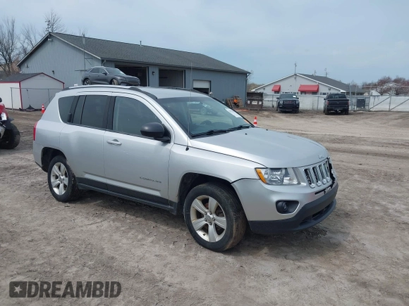2012 Jeep Compass Sport with VIN 1C4NJDBB4CD624163, listed as a IAAI auction lot 42025783 with 148,928 mi miles. Bid and sale history available at carsss.com. Image 1.