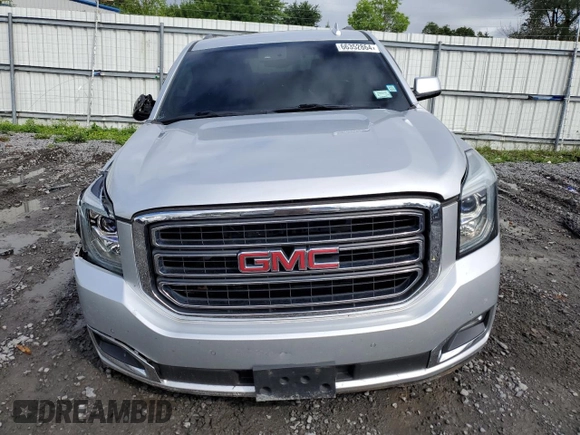 2015 GMC Yukon SLT with VIN 1GKS2BKC9FR518381, listed as a Copart auction lot 66352864 with 103,419 mi miles and Salvage Title. Bid and sale history available at DreamBid. Image 5.