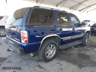 2003 Chevrolet Tahoe LT with VIN 1GNEC13T03J180708, listed as a IAAI auction lot 41543671 with 203,442 mi miles. Bid and sale history available at carsss.com. Image 4.