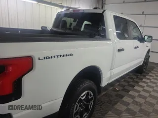 2023 Ford F-150 Lightning Pro z VIN 1FTVW1EL0PWG02840, wystawiony jako IAAI lot #42379448 z przebiegiem 52 710 mil mil oraz . Historia ofert i sprzedaży dostępna na DreamBid. Obrazek 24.