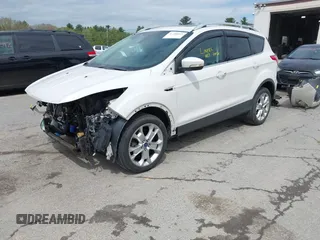 2016 Ford Escape Titanium with VIN 1FMCU9J98GUA00832, listed as a IAAI auction lot 42188941 with 90,764 mi miles and . Bid and sale history available at DreamBid. Image 2.