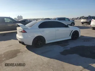2014 Mitsubishi Lancer Evolution GSR z VIN JA32W8FV5EU023703, wystawiony jako Copart lot #72744504 z przebiegiem Nie podano mil oraz Szkody całkowita. Historia ofert i sprzedaży dostępna na DreamBid. Obrazek 3.