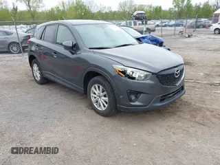 2014 Mazda CX-5 Touring with VIN JM3KE2CYXE0332517, listed as a IAAI auction lot 42109592 with 138,214 mi miles. Bid and sale history available at carsss.com. Image 1.
