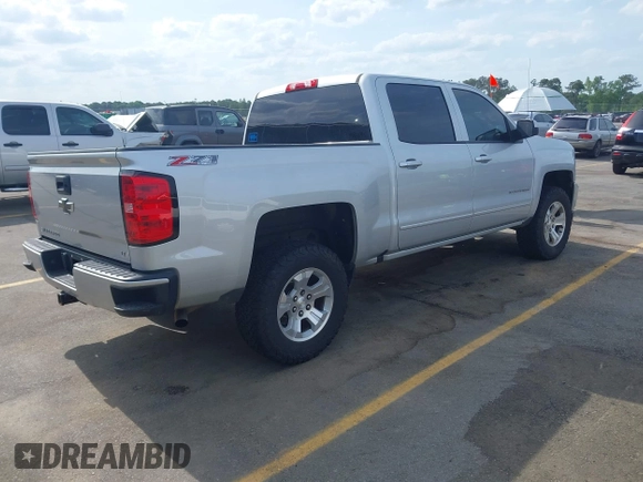 2017 Chevrolet Silverado 1500 LT with VIN 3GCUKREC5HG285689, listed as a IAAI auction lot 42055959 with 128,237 mi miles and . Bid and sale history available at DreamBid. Image 4.