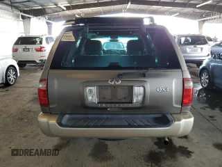 2001 Infiniti QX4 with VIN JNRDR09X21W204448, listed as a Copart auction lot 82619574 with 114,520 mi miles and Salvage Title. Bid and sale history available at DreamBid. Image 6.