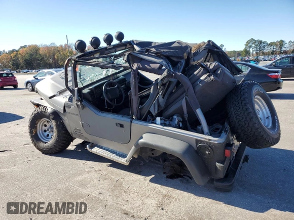 2001 Jeep Wrangler SE with VIN 1J4FA29P71P310653, listed as a Copart auction lot 81682424 with 0 mi miles and Salvage Title. Bid and sale history available at carsss.com. Image 2.